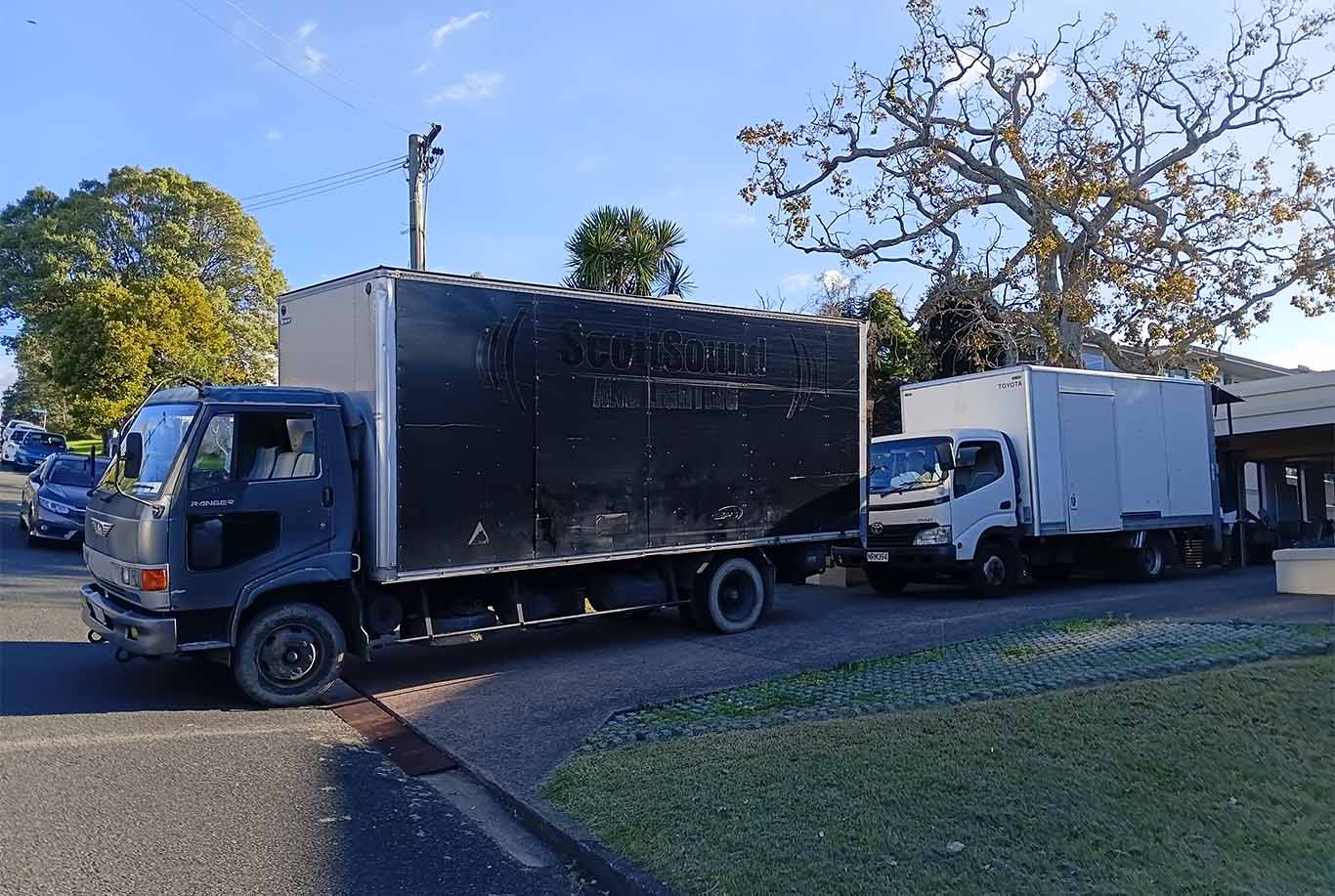 XMOVERS fleet of modern moving trucks parked together showing 20m³ and 30m³ capacity vehicles for long-distance North Island relocations