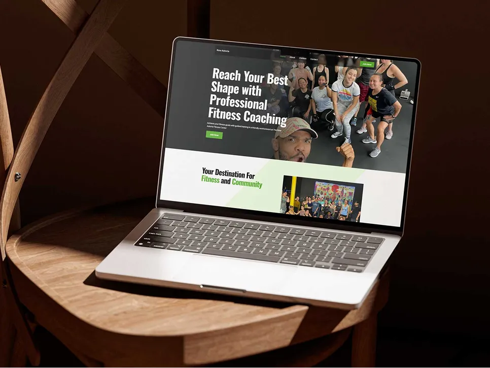The Row Astoria mockup on a macbook placed on a wooden chair