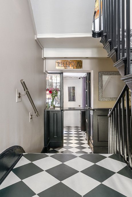 Entrance and stair with chequerboard floor
