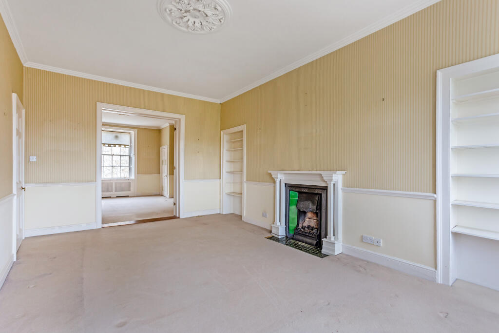 An original room at 1 Cavendish Crescent, with its fireplace and built-in shelving