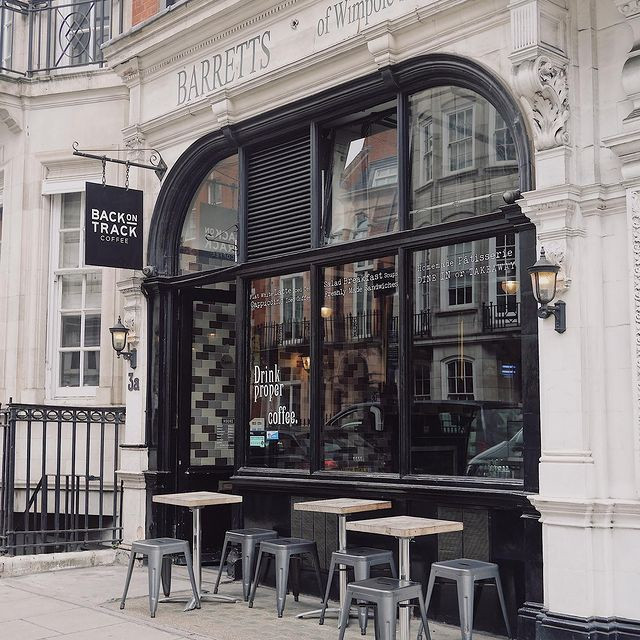 Back on Track Coffee's shopfront at 3a Wimpole Street, Marylebone, with its new illuminated sign, fascia lettering and pavement seating