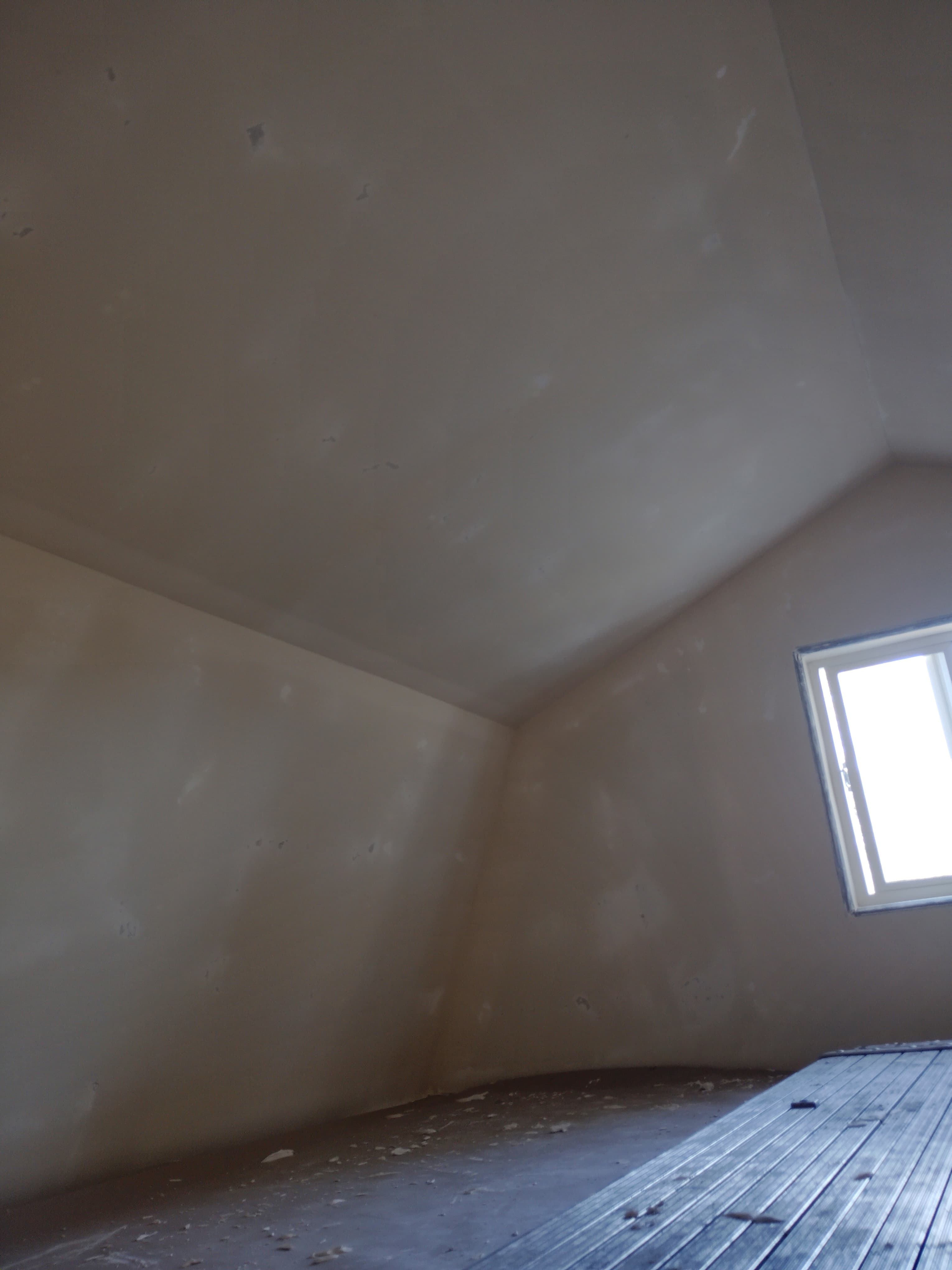 Vaulted ceiling drywall installation with finished seams in an Arroyo Grande bonus room