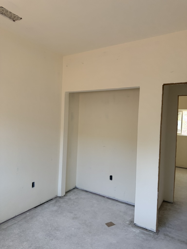 Drywall installation around a closet alcove in a San Luis Obispo home
