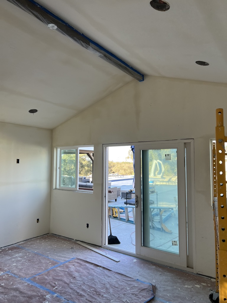 Vaulted ceiling drywall around an exposed beam in an Oceano home