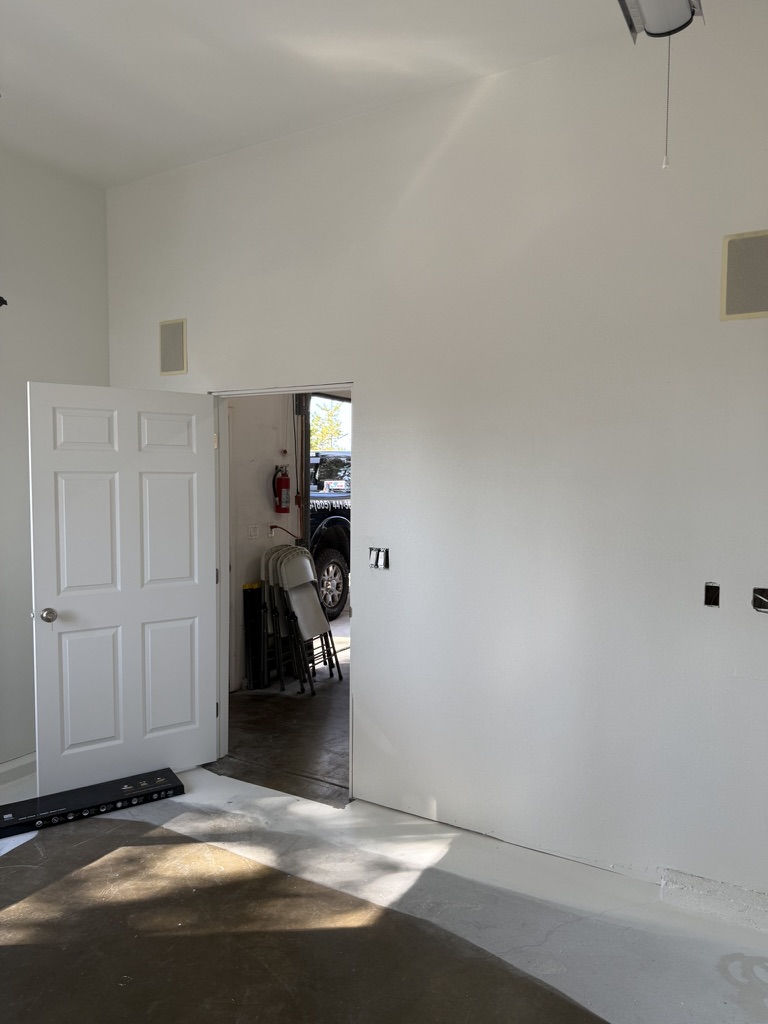 Smooth drywall walls and high ceiling in a completed Arroyo Grande room addition