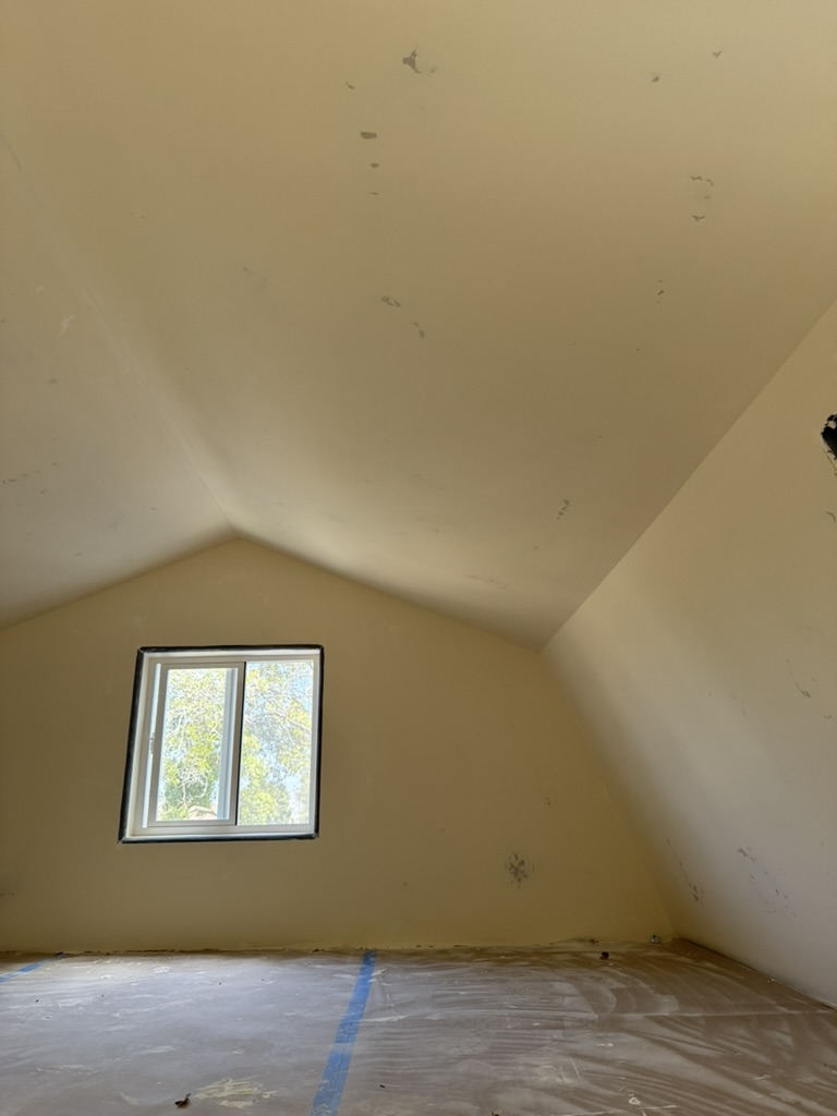 Finished attic conversion with vaulted drywall ceiling in Pismo Beach