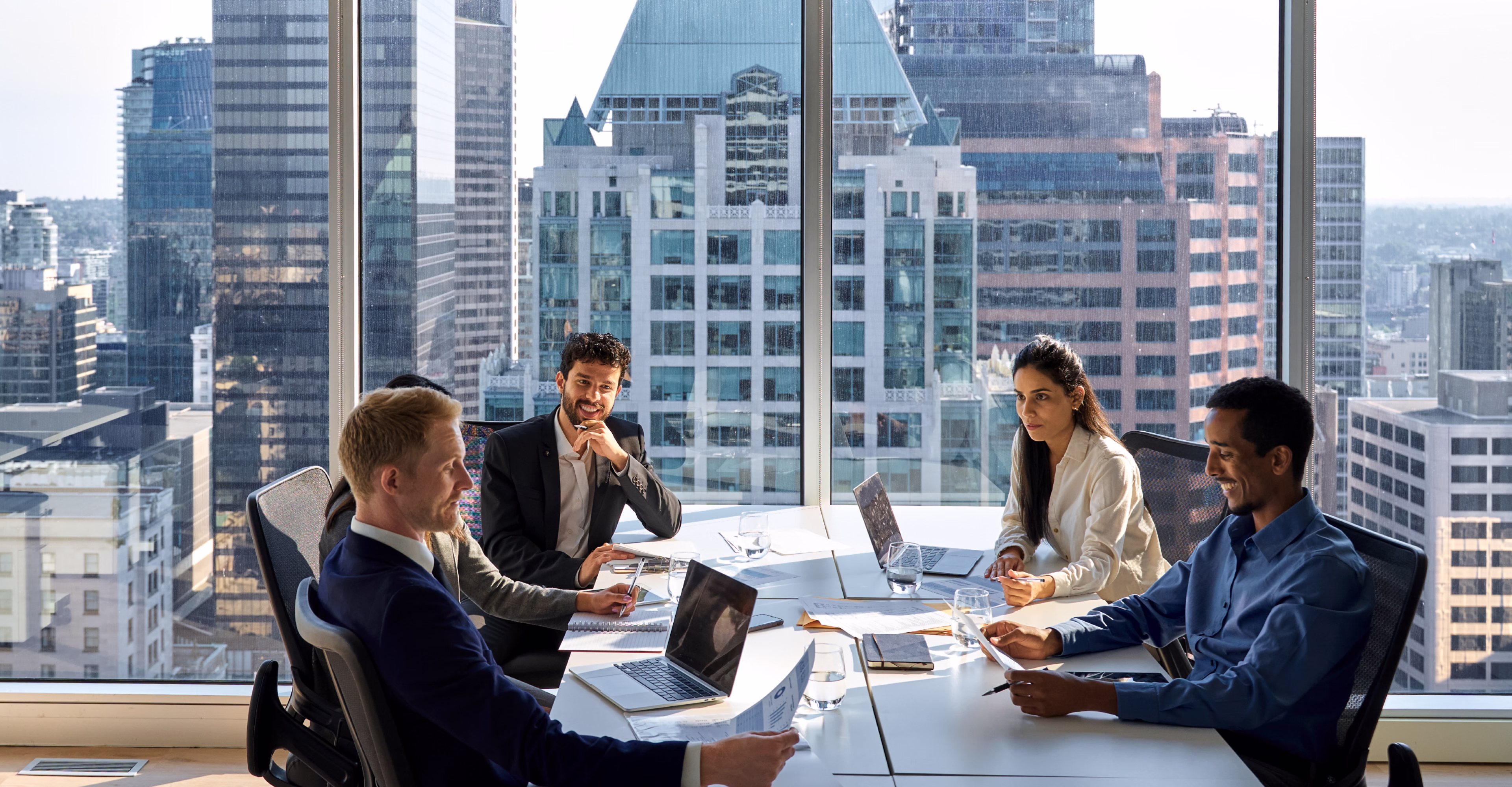 Leadership team meeting in a high-rise office