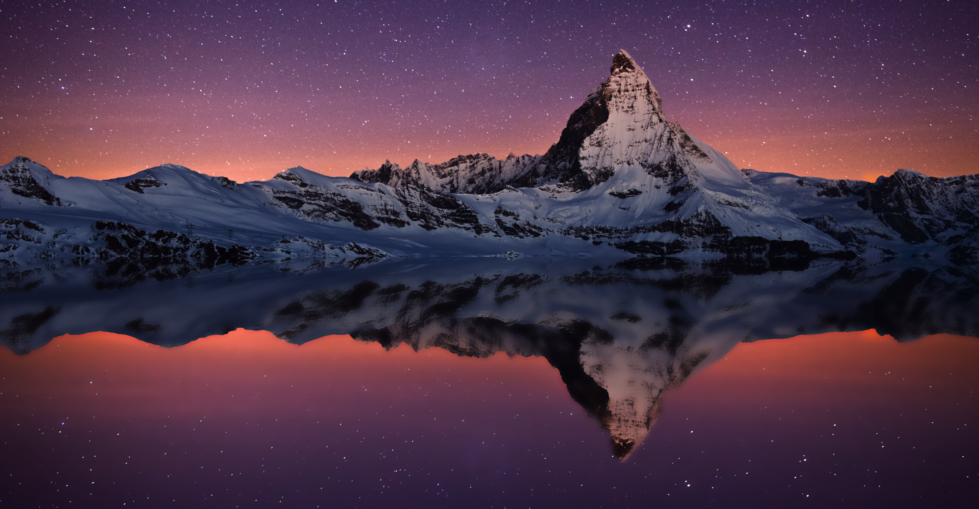 Mountain peak reflected in an alpine lake at dusk