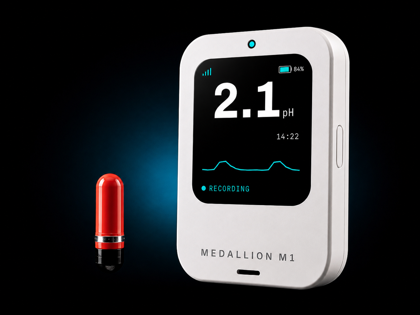 The Heidelberg pH Capsule beside the Medallion M1 reader showing a live 2.1 pH stomach-acid measurement