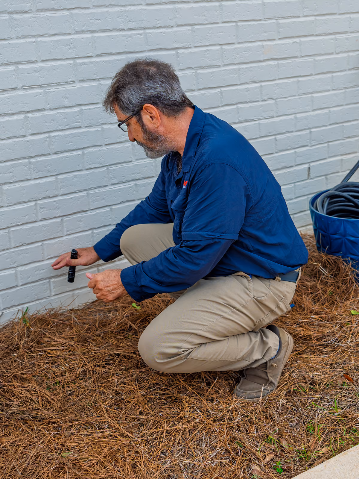 inspecting the exterior of a florida home for pest activity