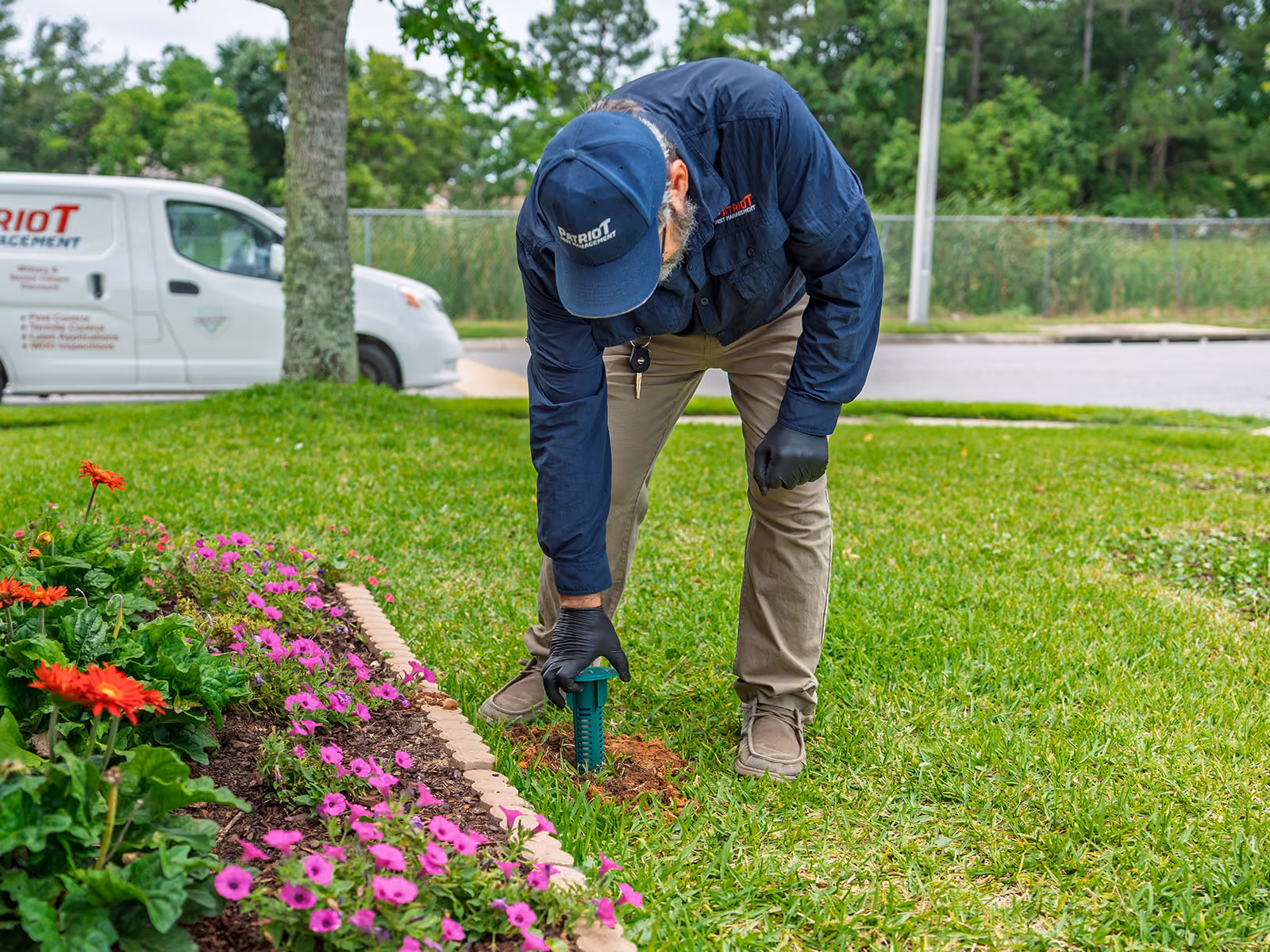 florida termite control tech installing a sentricon termite bait station