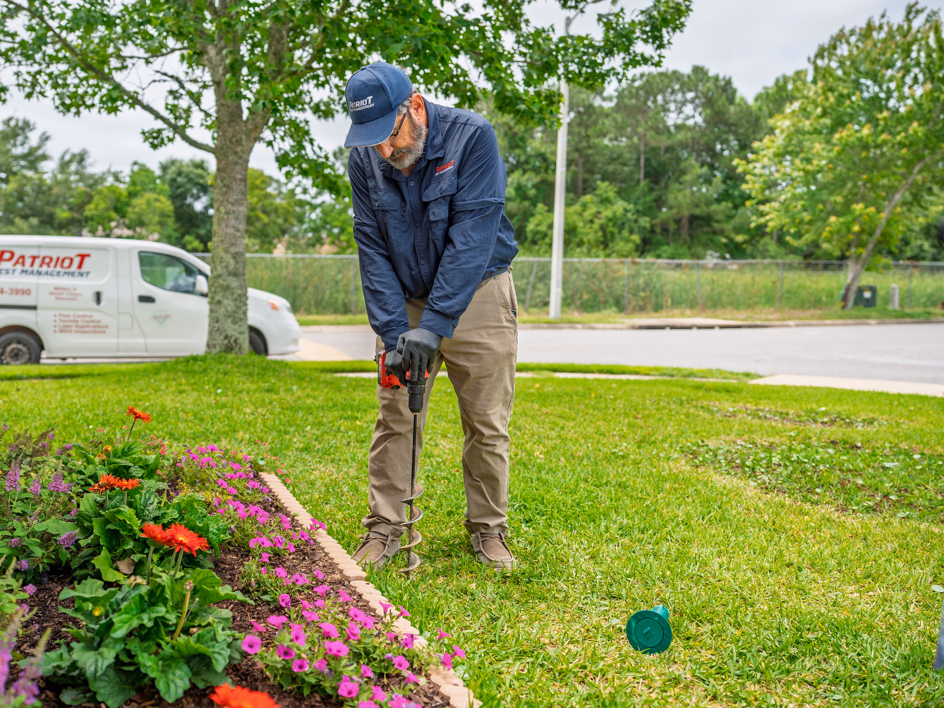 fl termite technician installing a sentricon bait station