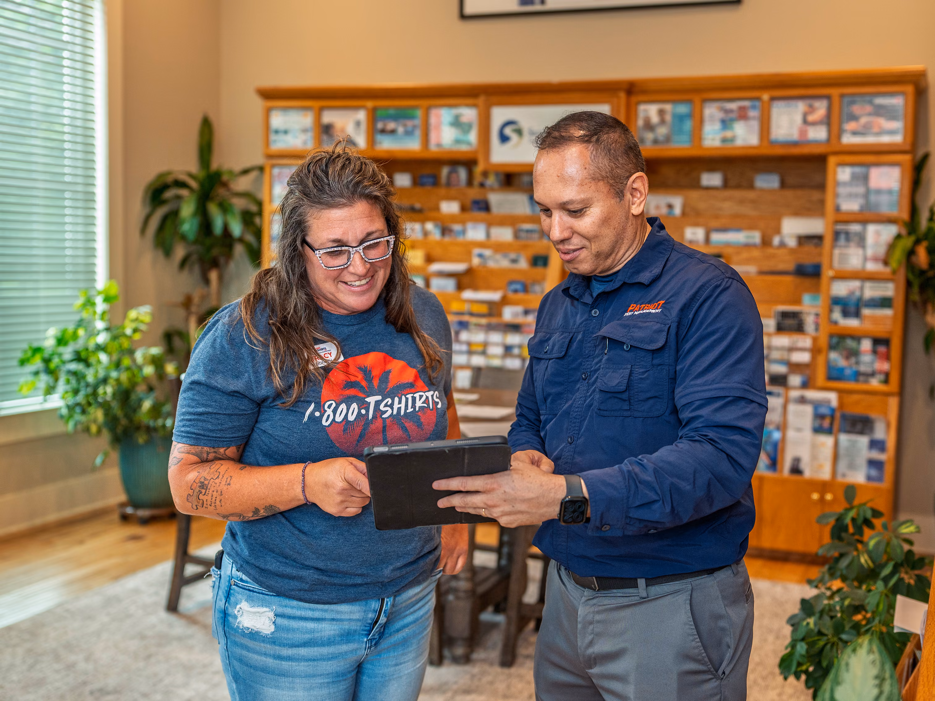 commercial pest control expert reviewing services with a customer