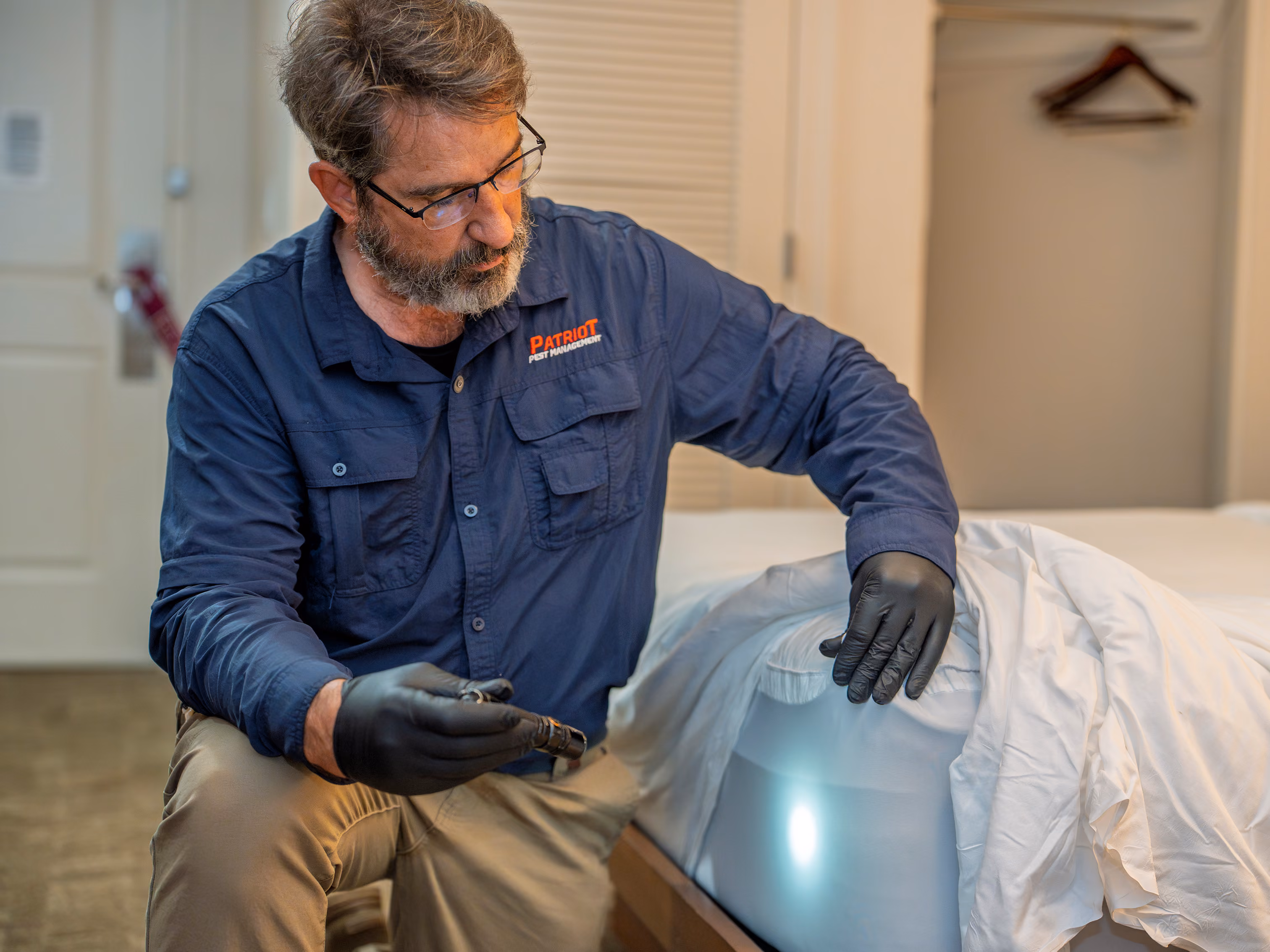 inspecting a bed for bed bugs