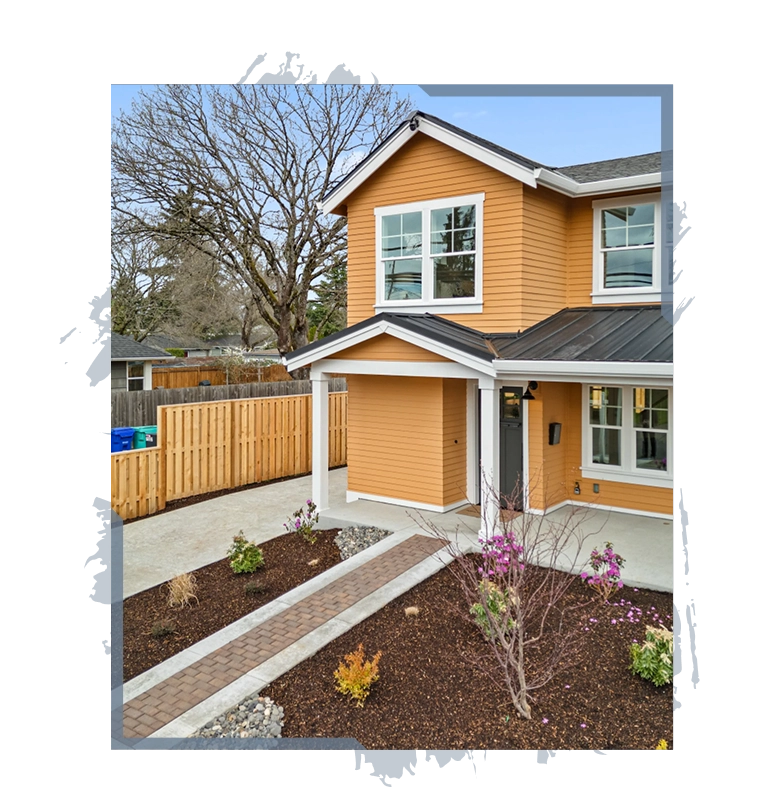 Two-story orange house with white trim, a covered porch, a brick walkway, and landscaped front yard.