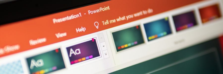 Microsoft PowerPoint presentation themes interface displayed on a computer monitor screen