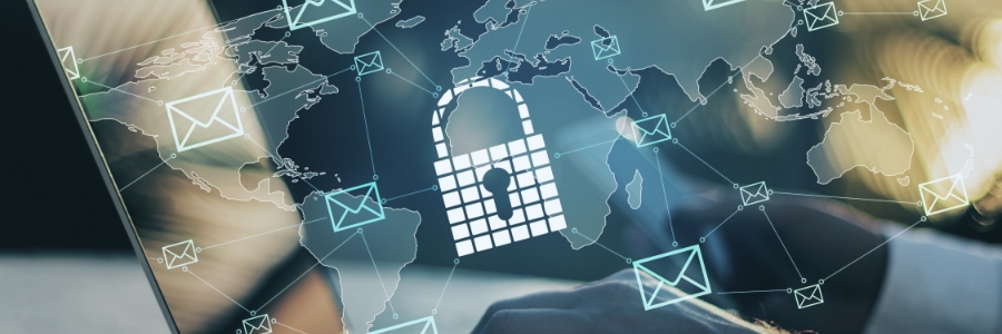 Glowing padlock icon over world map with email envelope icons connected by network lines, hands typing on laptop
