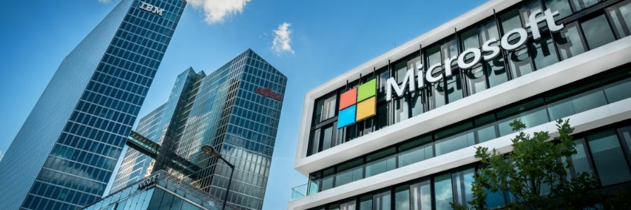 Microsoft office building exterior with IBM and SAP towers in background, representing enterprise technology solutions