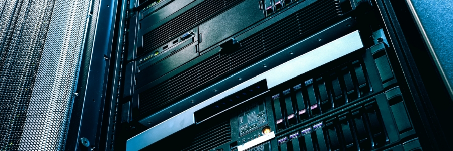 Rack-mounted servers and hardware in a data center, showing enterprise IT infrastructure used for backup and recovery systems