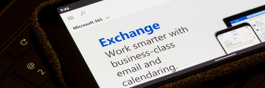 Microsoft 365 Exchange Online webpage displayed on a tablet, promoting business-class email and calendaring cloud solutions