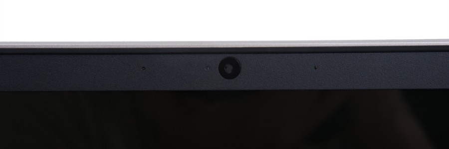 Close-up of a laptop webcam centered in a dark bezel, highlighting the built-in camera used in PC security settings