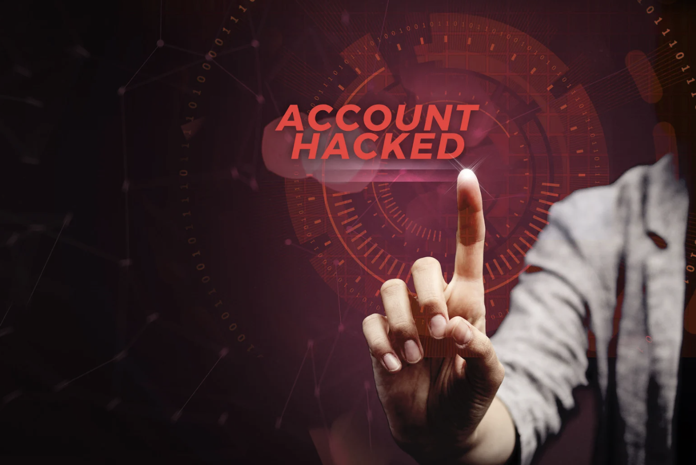 Person pointing at glowing red Account Hacked alert on digital interface with binary code, cybersecurity threat concept