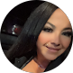 Smiling professional woman with dark hair, representing IT support services for businesses in Thousand Oaks CA