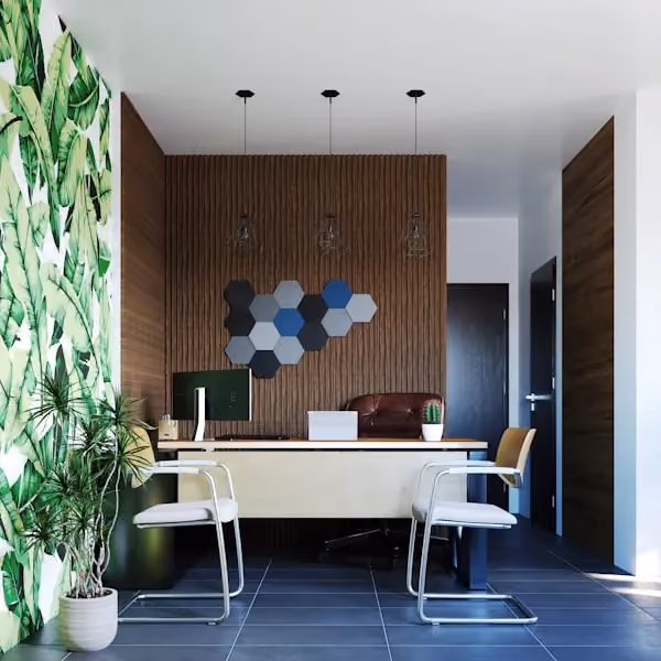 A room with a desk, chairs and a plant