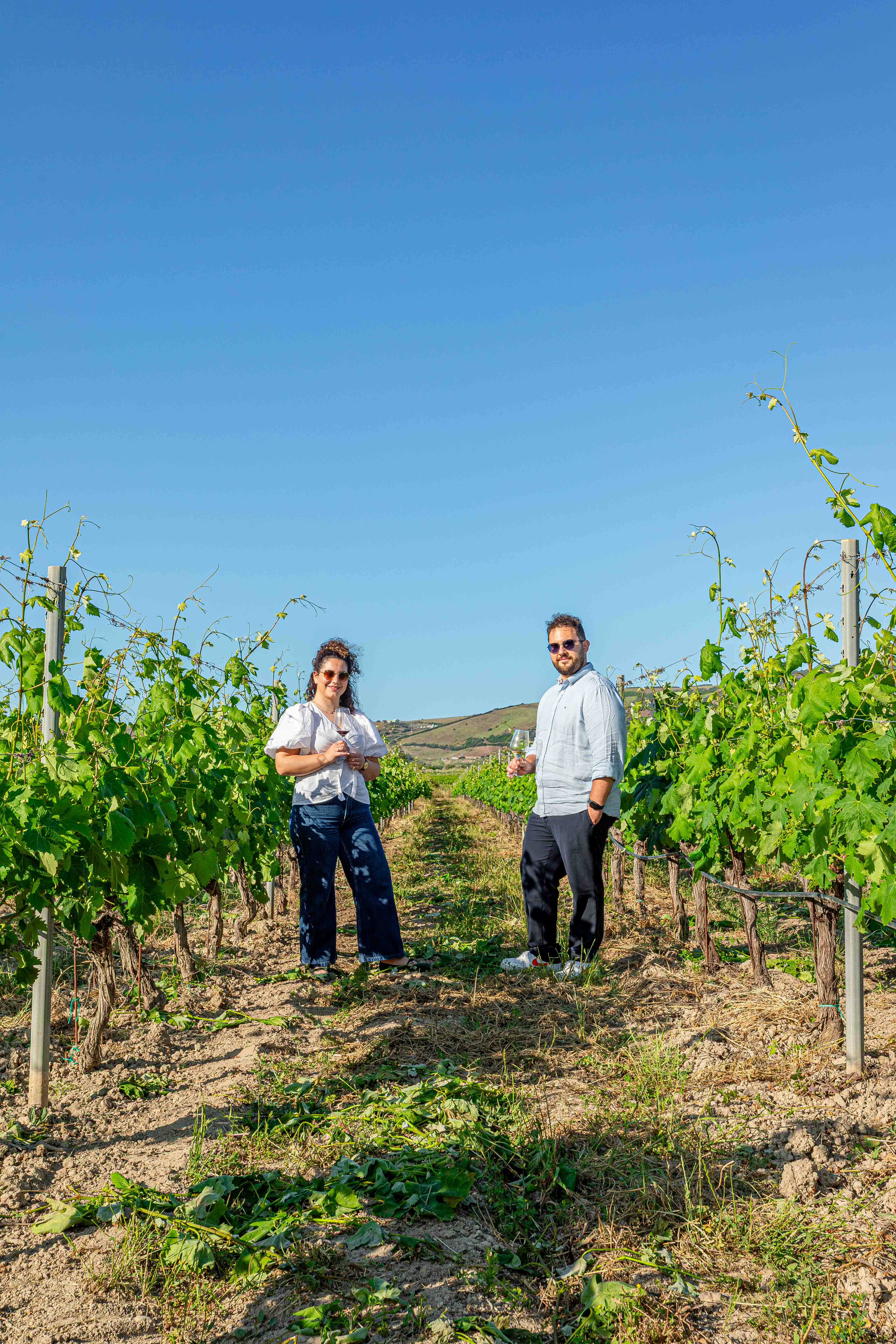 Co-founders Lucia and Giacomo in a Sardinian vineyard