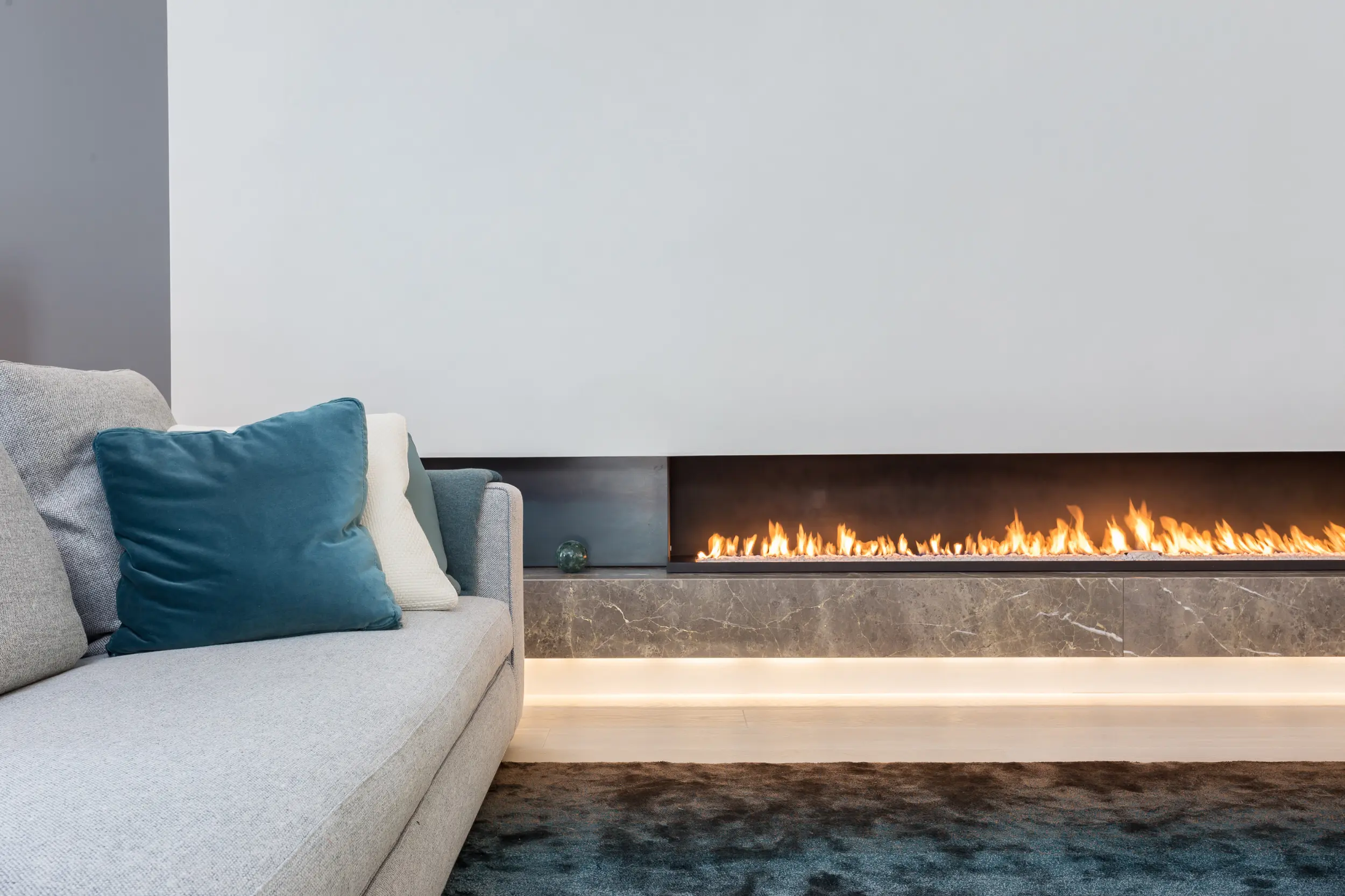 2.4-metre open-front linear gas fireplace with hot-rolled steel side panels in modern living space