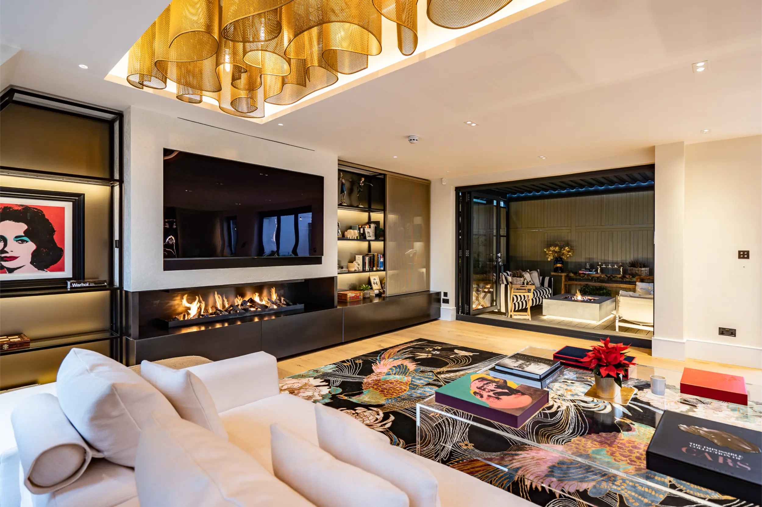 Bespoke linear gas fireplace within media wall in a luxury Kensington penthouse by Modus Fireplaces