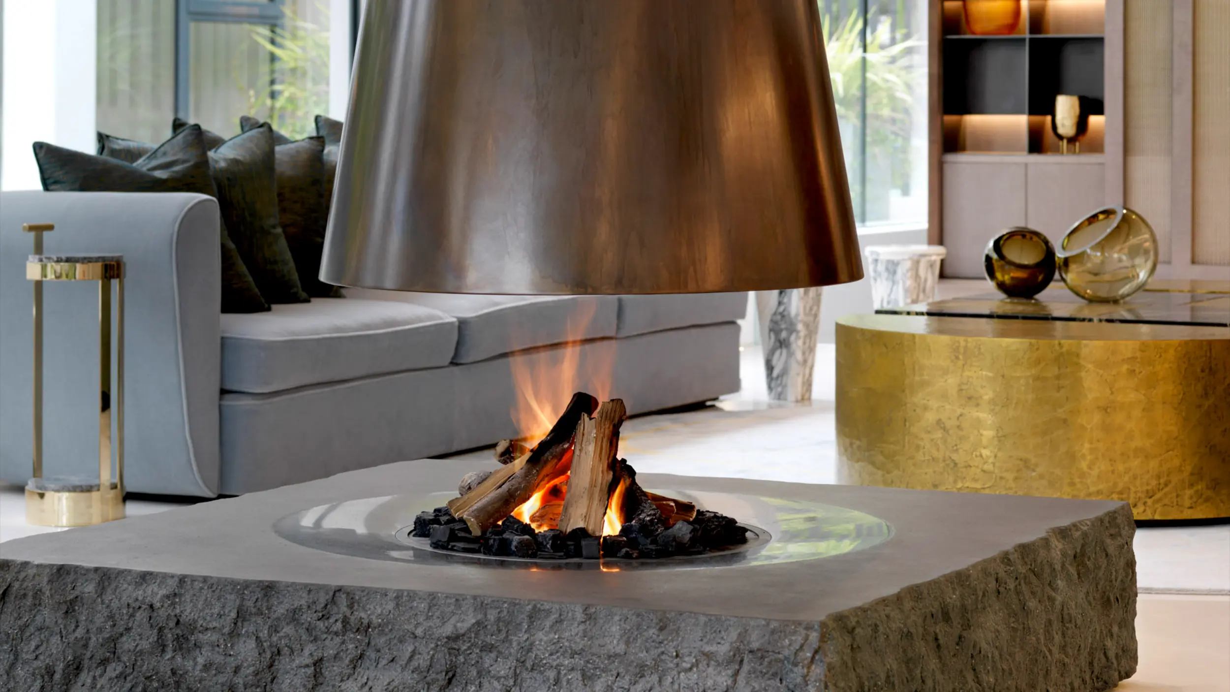 Suspended conical fireplace with antique brass canopy in London,