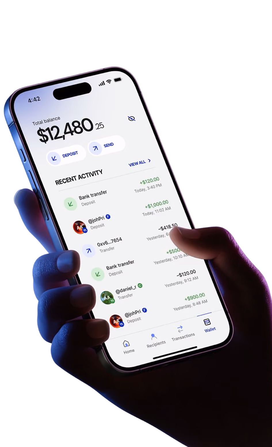 Hand holding a phone showing a finance app with $12,480.25 balance and recent transaction activity.
