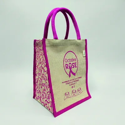 Sac en jute beige à poignées violettes pour campagne Octobre Rose de lutte contre le cancer du sein.