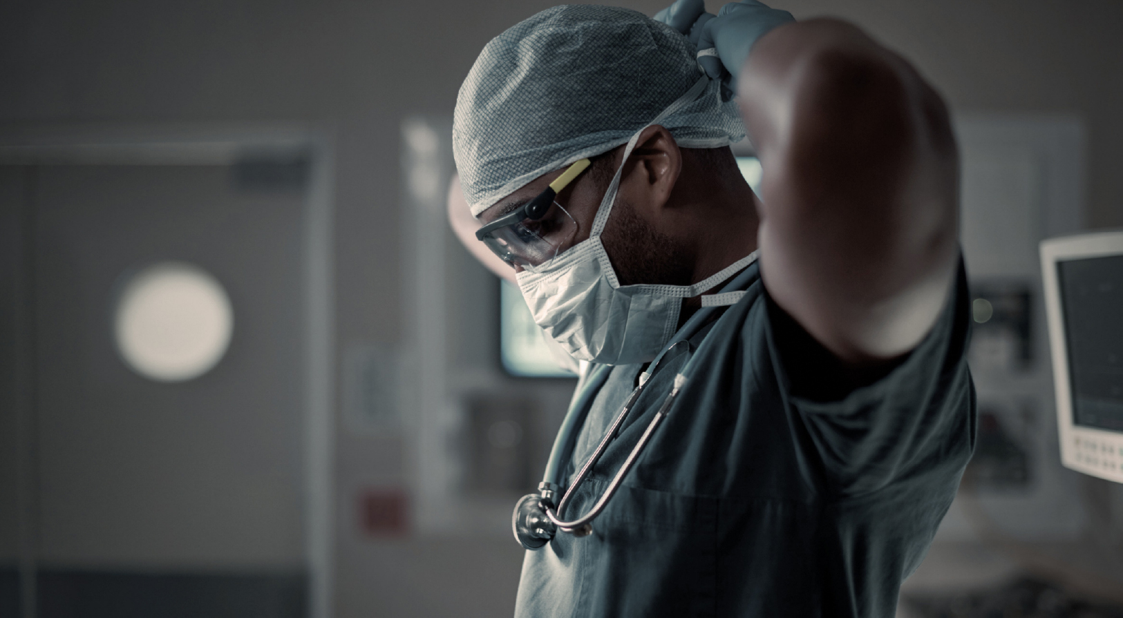 A surgeon reflecting on something before surgery.