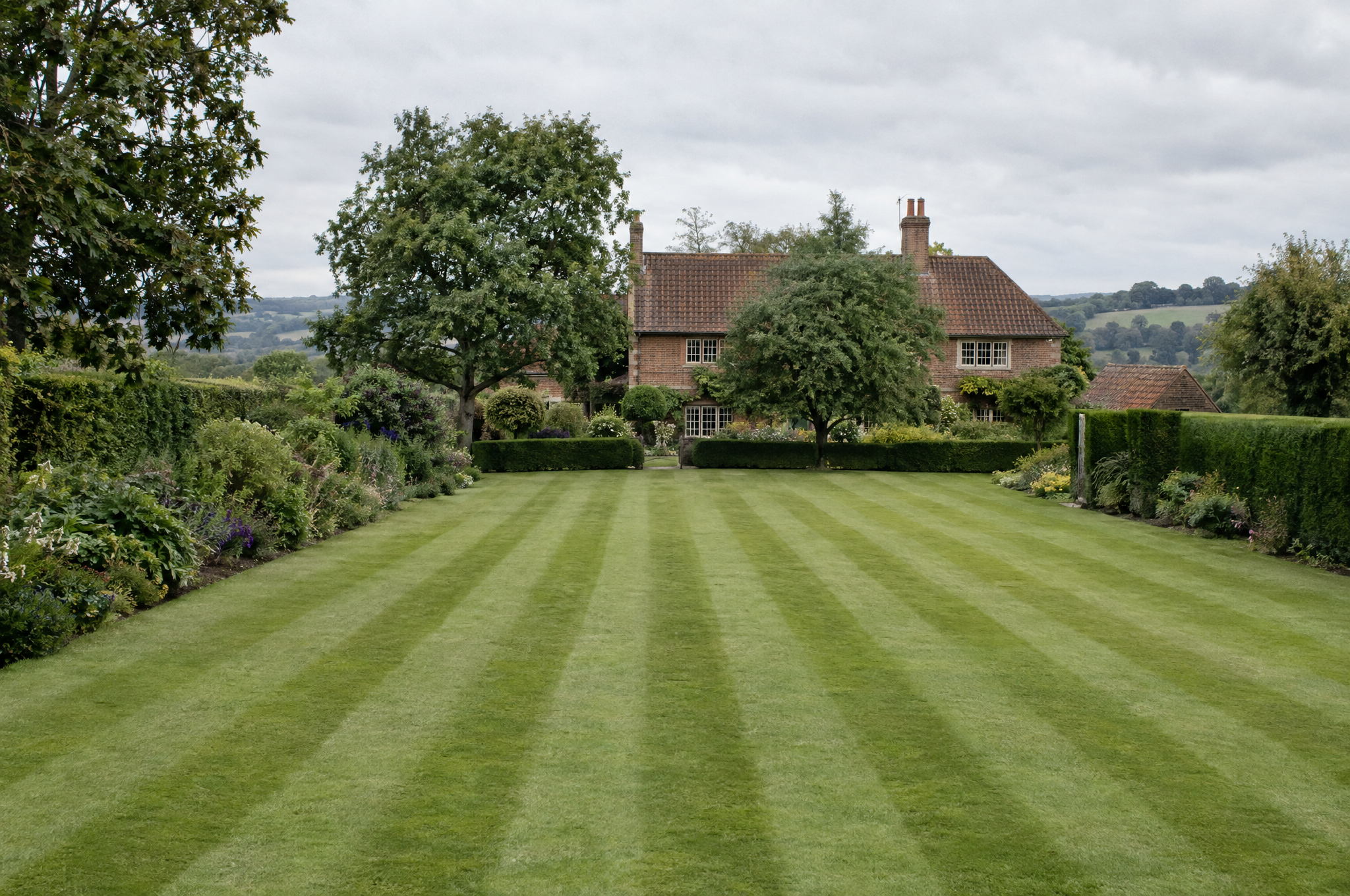 Wide lawn immediately after cutting, every clipping cleared and the surface clean