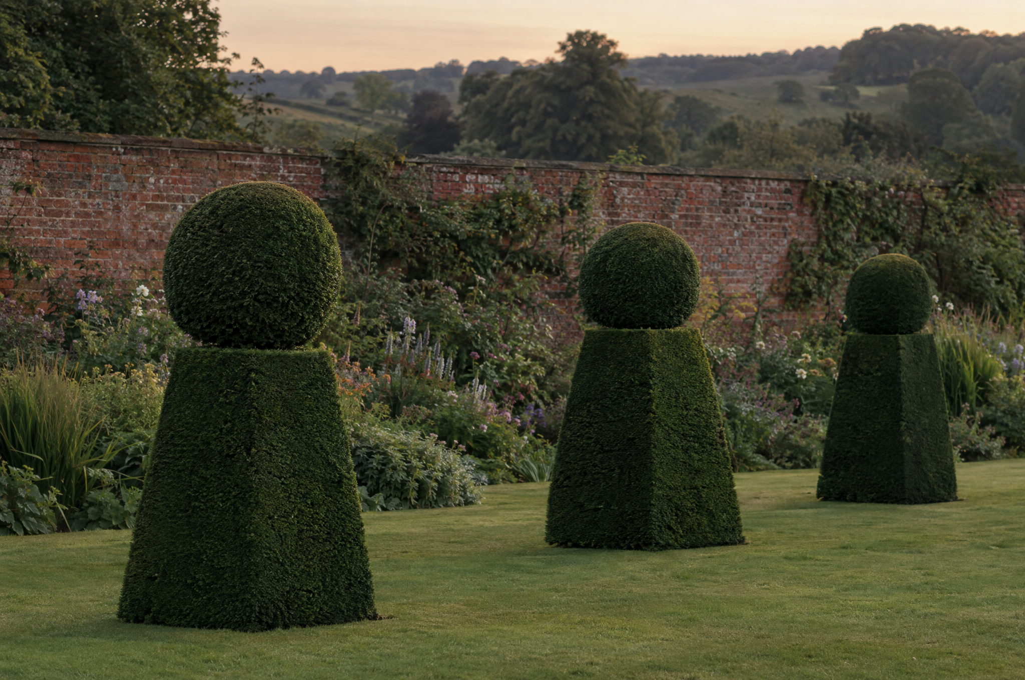 Formal yew topiary freshly cut with crisp faces in a country garden