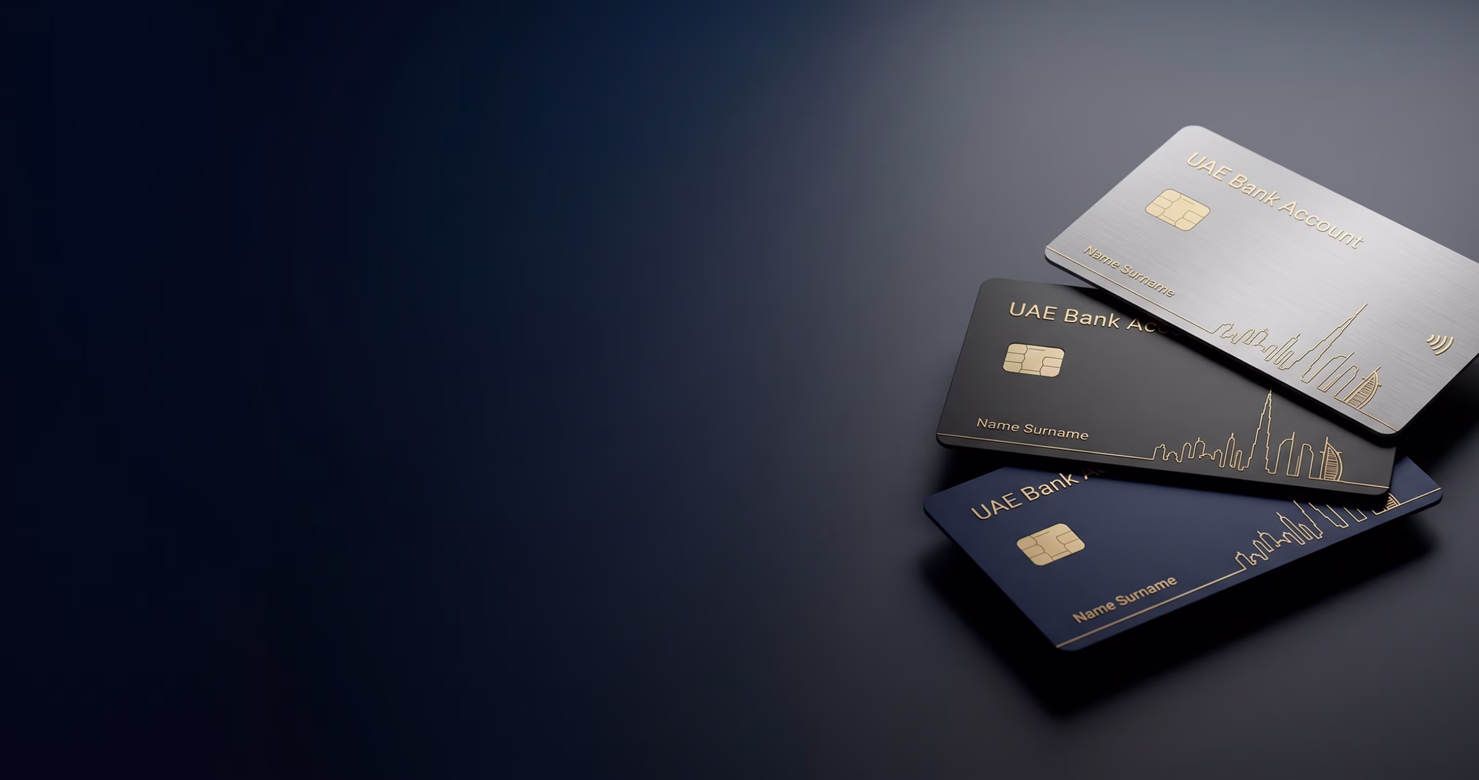 Three UAE bank cards in silver, black, and blue with a gold city skyline design on a dark surface.