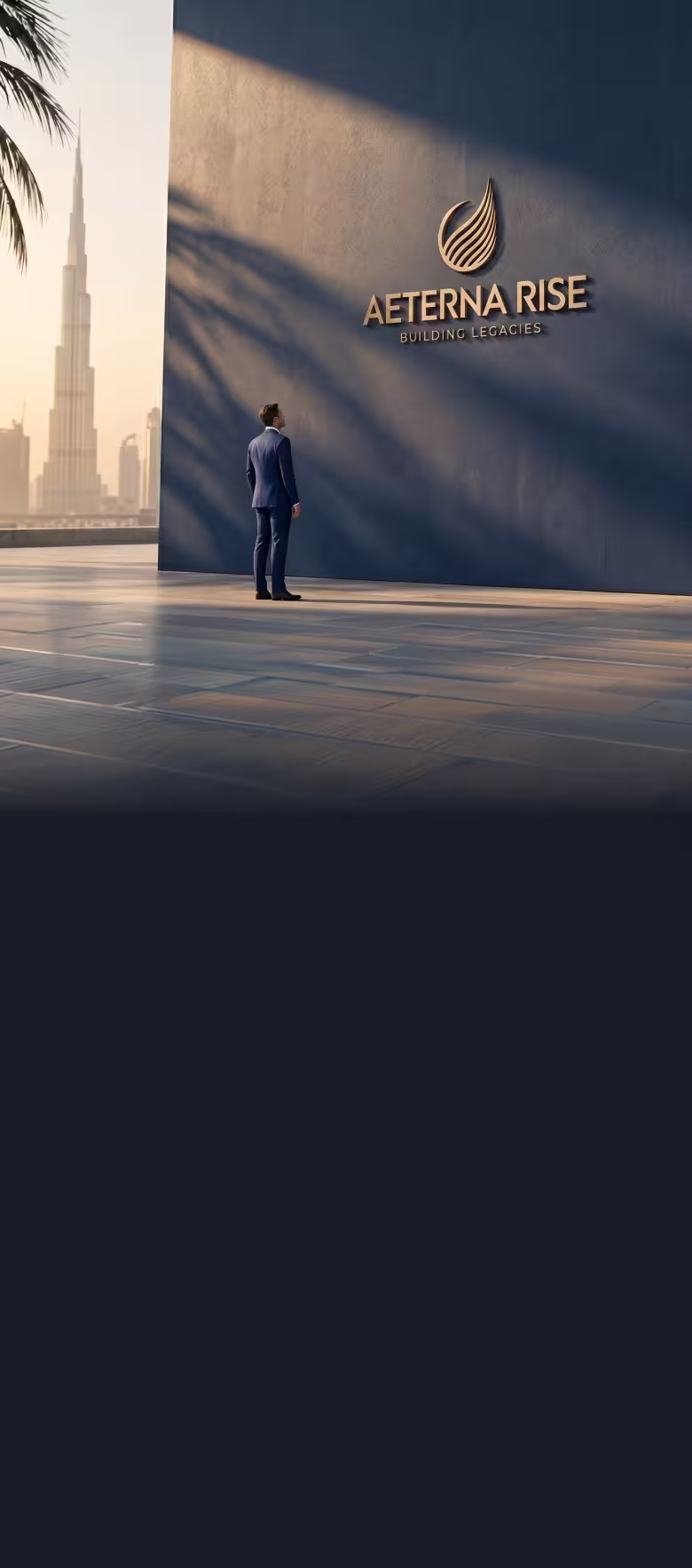 Man in a suit standing on a plaza looking at the Aeterna Rise logo on a large wall at sunset.