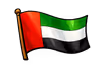 Flag of the United Arab Emirates waving on a black background.