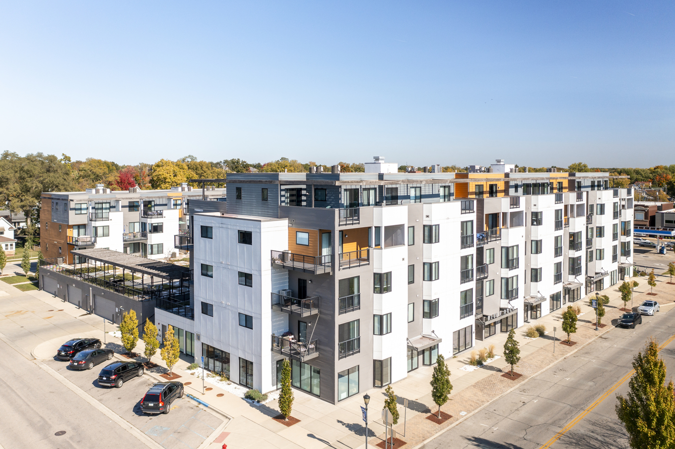 Aerial view of River Rock condominiums alongside the St. Joseph River and Mishawaka Riverwalk