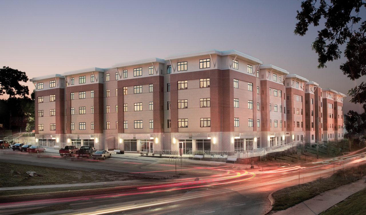 Exterior of Drake West Village at night from street