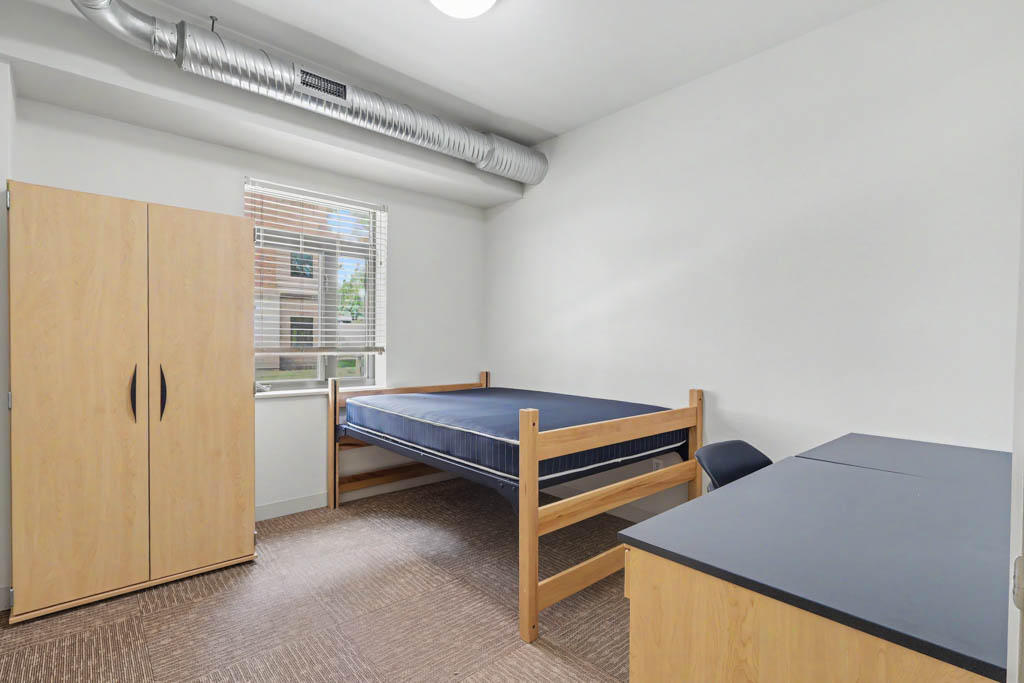 Bedroom with bed and desk