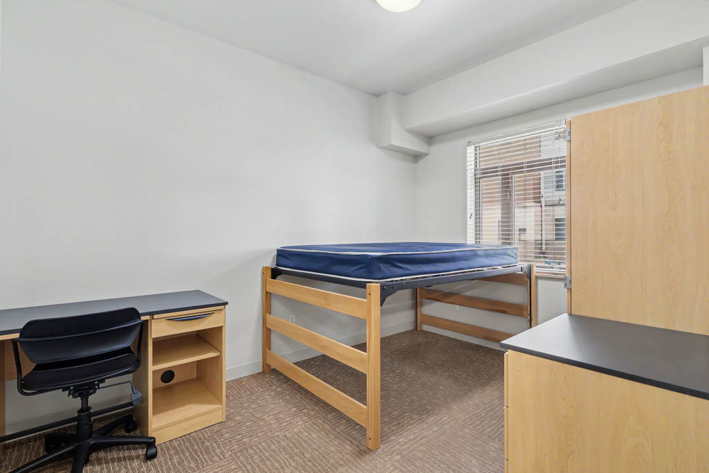 Bedroom with bed and desk