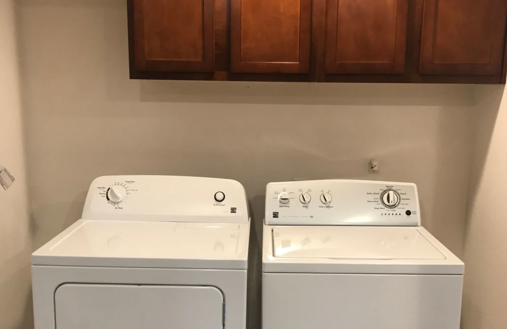 Full size washer and dryer with cabinets