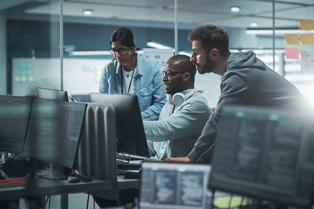 Netrix engineers collaborating on a Microsoft technology deployment