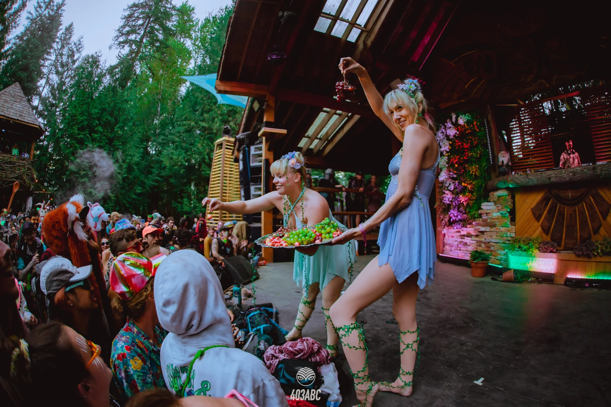 Cute Shambhala fairies entertaining the crowd and feeding grapes to ll who need them - Shambhala 2023 voted best festival in america