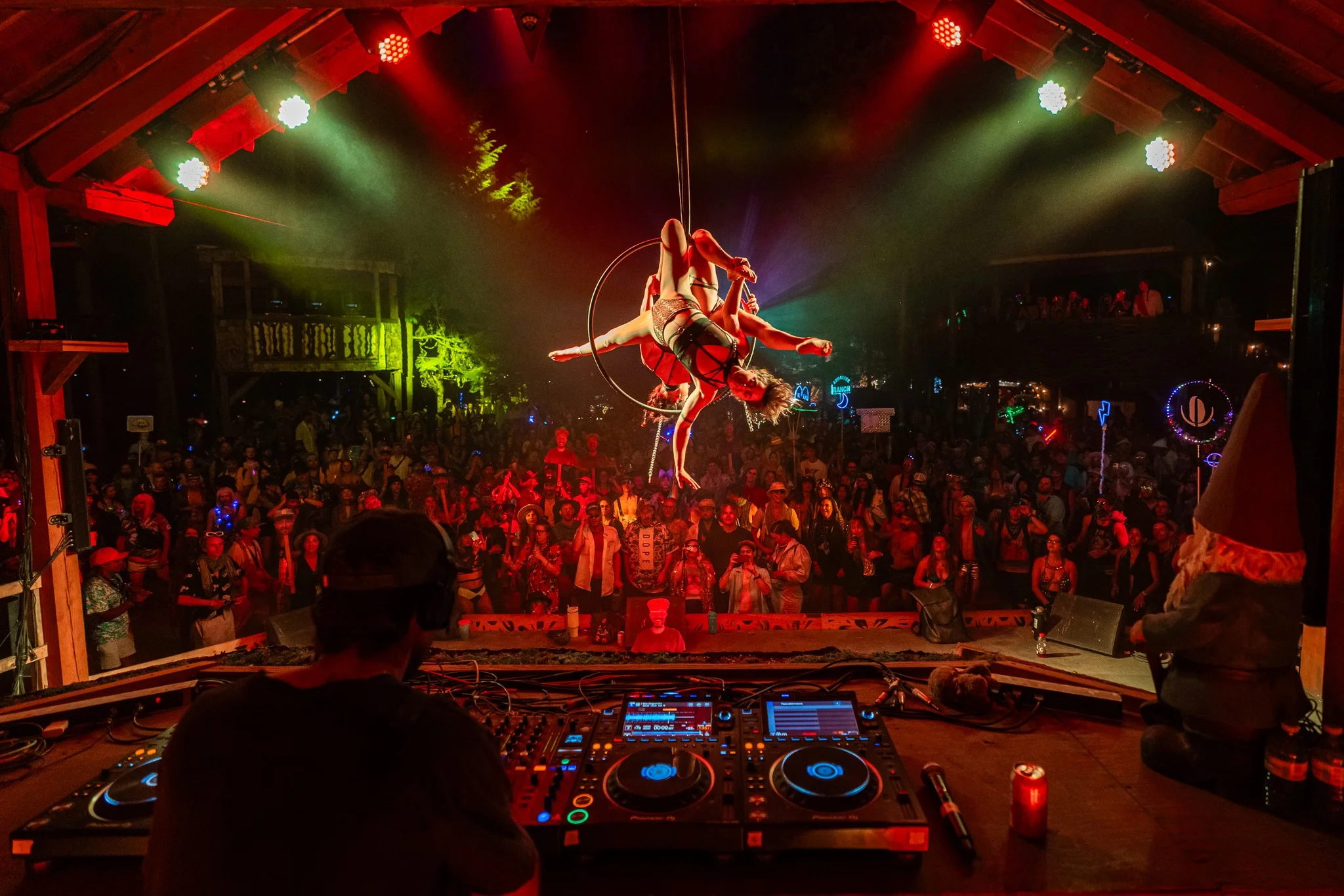 Shambhala 2023 festival acrobatic performers with DJ, hyping up the audience and giving the farmily another killer performance 