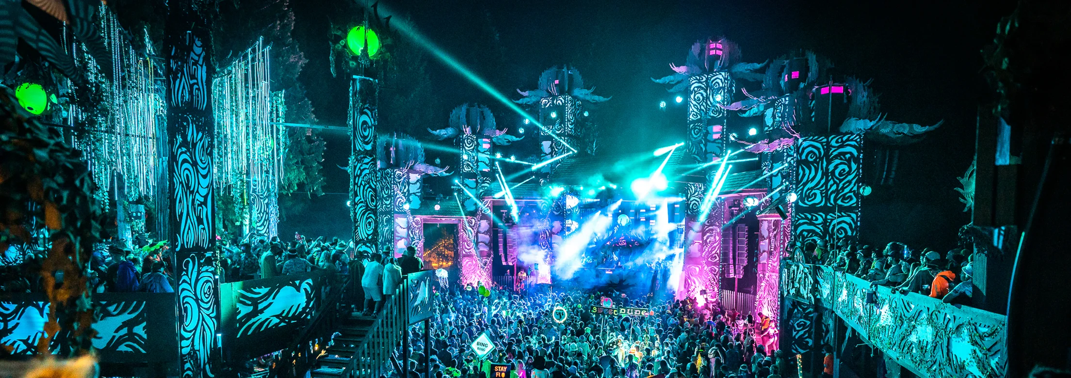 The Village Stage - Surrounded by towering cedar trees, a lively rushing river, and a loving and supportive community, Shambhala goers are in for the time of their lives.