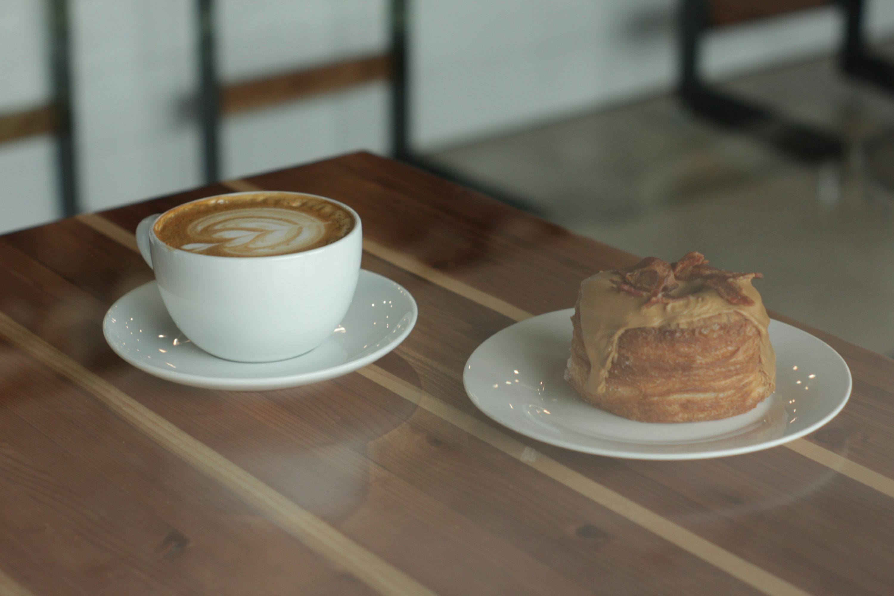 shallow focus photo of white ceramic mug and saucer